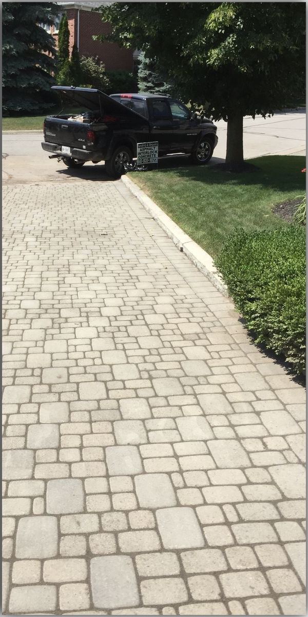 Interlock paver driveway cleaned clear of weeds and debris